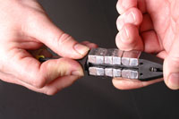 Individual weight segments can be mounted onto the stem and are held
in place by  simply depressing, rotating then releasing the upper cap.