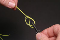 At this stage the knot should be wetted in order to help it close neatly