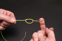 Take loop and close knot, at this stage the knot should be wetted in order
to help it close neatly