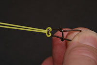 Draw back until loop draws back over itself, the link can now be attached
to the stem